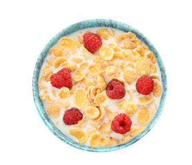 Bowl with corn flakes, milk and raspberries on white background. Healthy grains and cereals