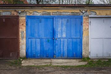 Row of old garages with metal gates in Roznov pod Radhostem, small town in Czech Republic