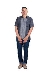 Fototapeta premium Young Asian man wearing batik shirt crying, standing. Isolated on white