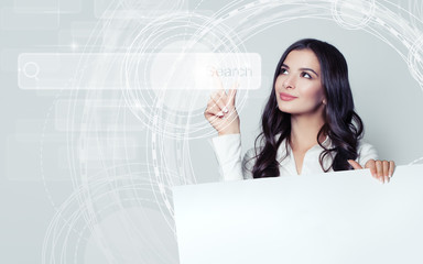 Successful business woman pointing to empty address bar in virtual web browser. Seo, internet...