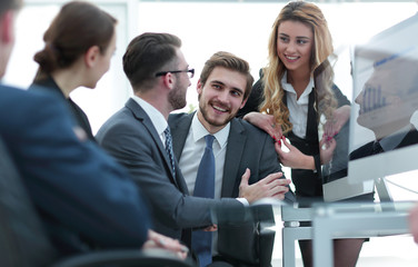 employees discussing financial charts