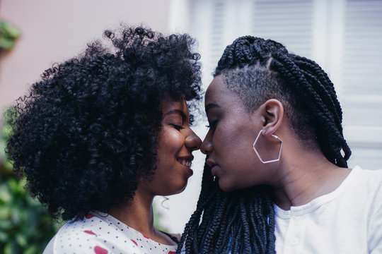 Two women about to kiss