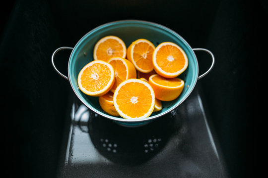 Cut Oranges in Strainer
