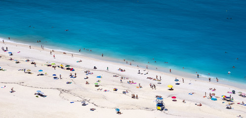 People on the Greek beach of Myrthos on Kefalonia island