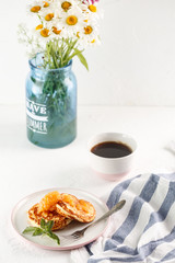 Cottage cheese pancakes, syrniki, curd fritters. Breakfast with coffee, cheesecake and apricot jam. copyspace