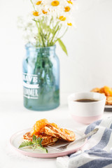Cottage cheese pancakes, syrniki, curd fritters. Breakfast with coffee, cheesecake and apricot jam. Flatlay. Top view. copyspace