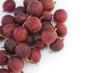 Ripe red gooseberries isolated on white background