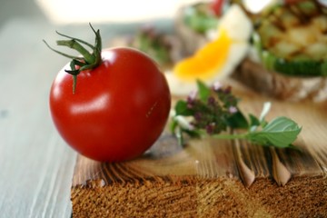 taste experience. summer vegetables. zucchini and tomato. a cooked egg. fast healthy breakfast
