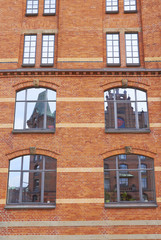 Fototapeta na wymiar Old brick house windows in Hamburg