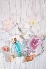 Perfume bottles and white flowers