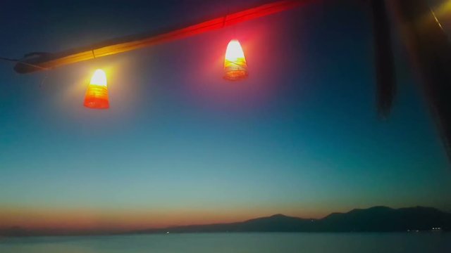Sea night view at Kalamos in Greece against the lights.
