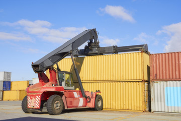 Toplifter working with cargo container in port