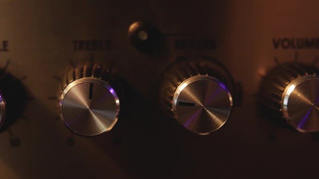 Slider shot of Volume Control Knobs on Electric Guitar Amp