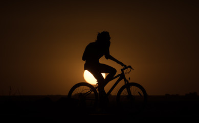 Silohuette of a bike at sunset