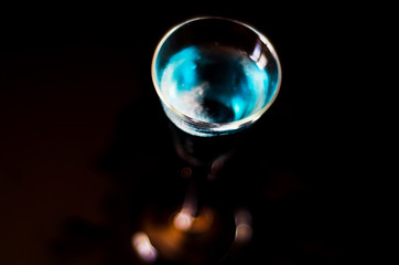 refreshing liqueur in a tall glass, alcoholic drink prepared by the bartender