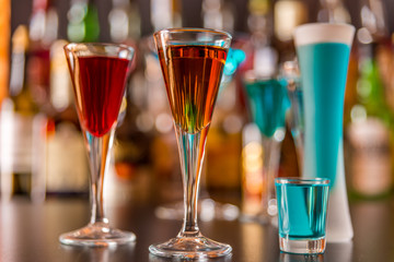 refreshing liqueur in a tall glass, alcoholic drink prepared by the bartender