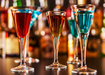 refreshing liqueur in a tall glass, alcoholic drink prepared by the bartender