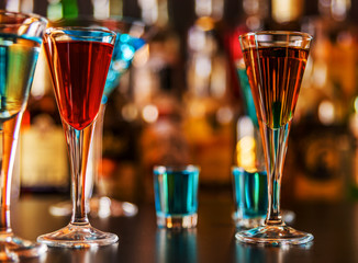 refreshing liqueur in a tall glass, alcoholic drink prepared by the bartender