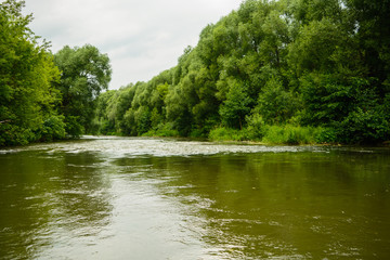 Fototapeta premium Idealistic landscape of fresh river with calm water in the forest