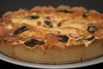 Quiche Tart Pie with Tomatoe, ,Spinach, Cheese. Foods and Pastries. Isoalted, Black Background. Selective Focus.