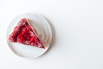 Strawberry cake top view on a white background. High key
