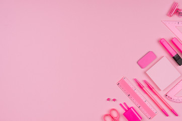 Pink office stationery collection on soft pastel pink paper  background, top view, copy space.