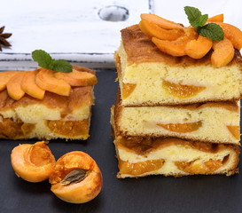 baked pieces of biscuit pie with apricots