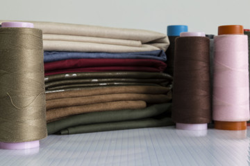 colorful bobbin on the white background for textile concept.