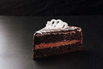 Chocolate cake on a black background