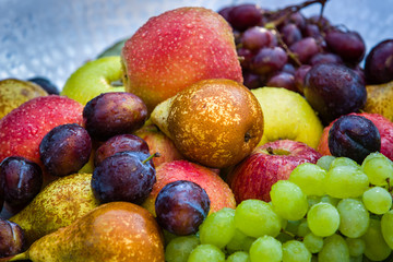 Naklejka na ściany i meble Fruit in a bowl - apples, pears, plums and grapes