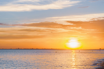 Fototapeta premium Beautiful summer sunset with clouds over the sea