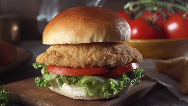 Parallax slider footage of a delicious fish burger sandwich.