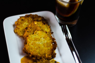 potato pancakes with spicy stew, delicious traditional dish, Hungarian cuisine