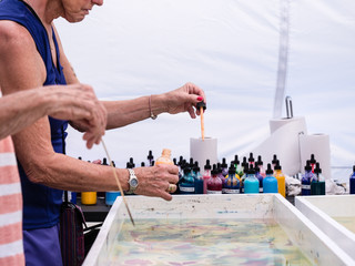 Artist mixing paint