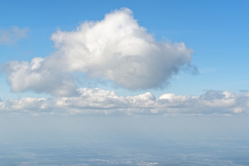 Obraz premium View from porthole, airplane window to beautiful cloudy sky - cloudscape