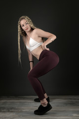 Fototapeta premium Beautiful woman with braids hairstyle. Dancehall dancer.