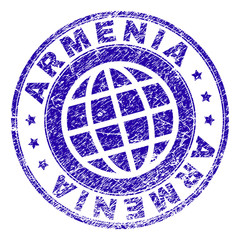 ARMENIA stamp print with distress effect. Blue vector rubber seal print of ARMENIA text with retro texture. Seal has words placed by circle and globe symbol.