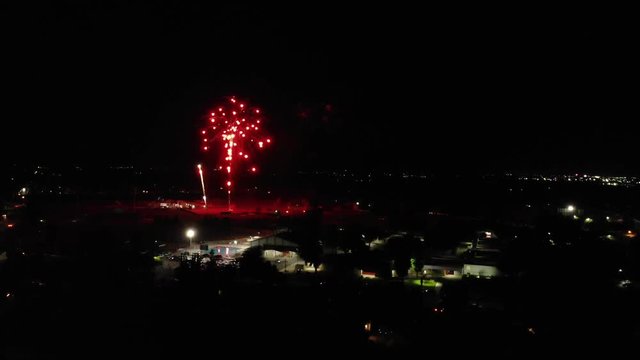 Rising shot of small town firework show