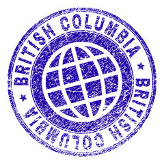 BRITISH COLUMBIA stamp print with distress texture. Blue vector rubber seal print of BRITISH COLUMBIA title with dust texture. Seal has words arranged by circle and globe symbol.