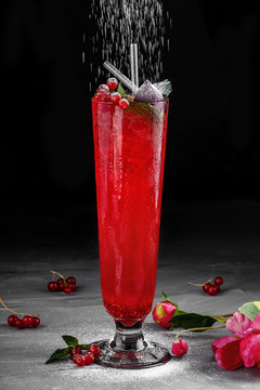 Cold Red Cocktail With Red Currant, Orange And Ice In Tall Glass On Dark Background. Summer Drinks And Alcoholic Cocktails.