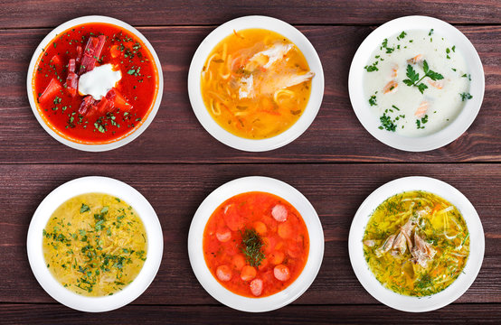 Set of soups. Cream soup with mushrooms, asian fish soup, solyanka, russian borscht, chicken soup, isolated on white.