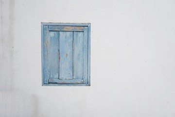 wood window on cement wall