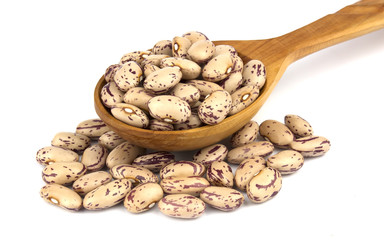Haricot beans in a wooden spoon  isolated on white background