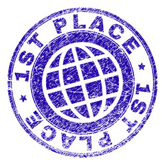 1ST PLACE stamp print with grunge effect. Blue vector rubber seal print of 1ST PLACE label with dust texture. Seal has words arranged by circle and planet symbol.