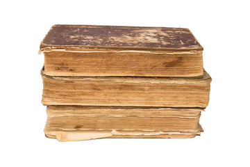 A stack of old tattered books. Vintage torn books. Antiques isolated