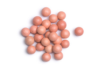 Close up of bronzing face pearls make up powder isolated on a white background.