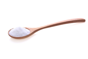 White sugar in a wooden spoon isolated on white background.