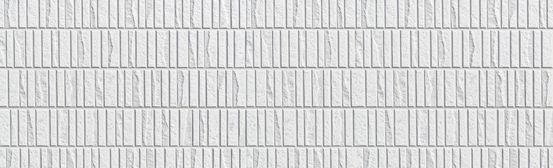 Panorama of Modern white stone tile wall pattern and seamless background