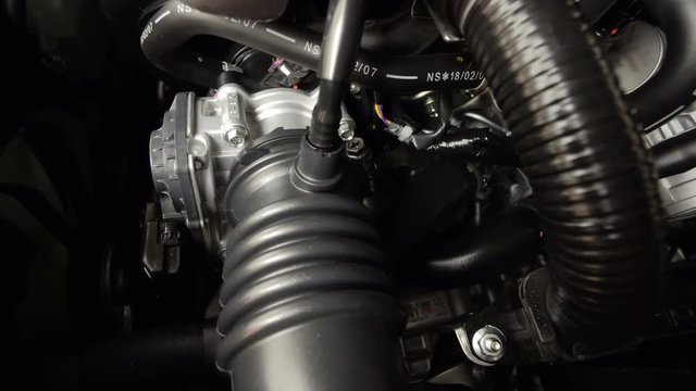 Closeup detailed view of new car engine compartment, Dolly shot
