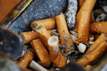 Cigarette butt, risk of lung cancer and many health problem, cause of respiratory disease and death , law and social ordering and responsibility by smoking zoning and stop smoking in public